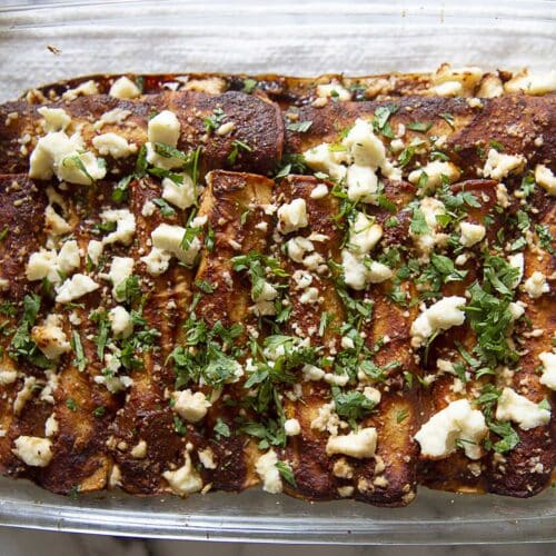 a tray of red chicken enchiladas