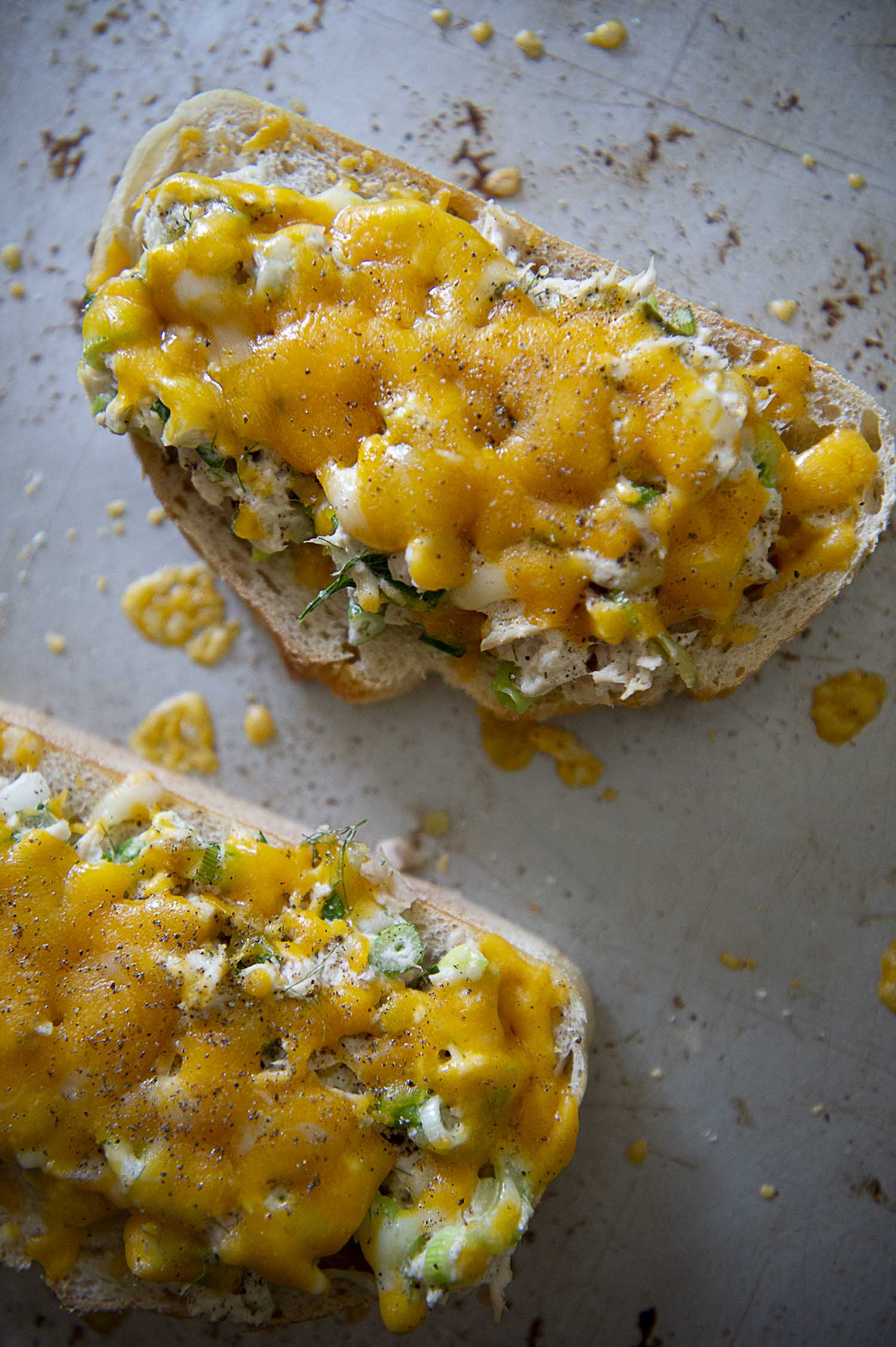 Tuna melt sandwich on a baking tray