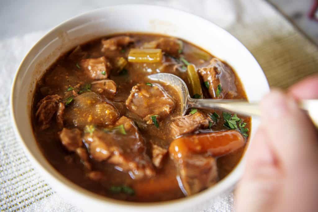 Crockpot beef stew in a white bowl