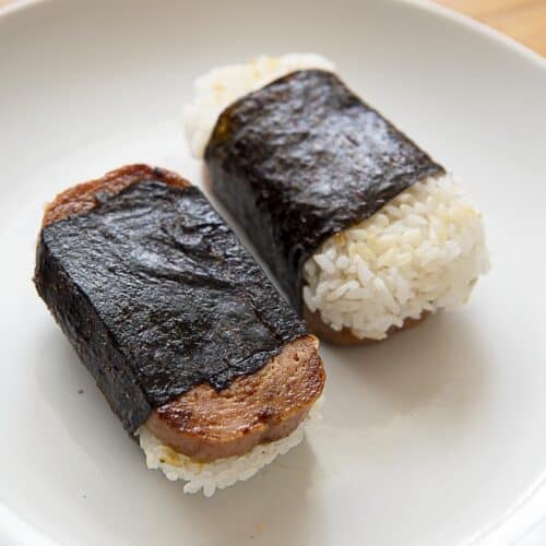 Two Spam musubis on a white plate