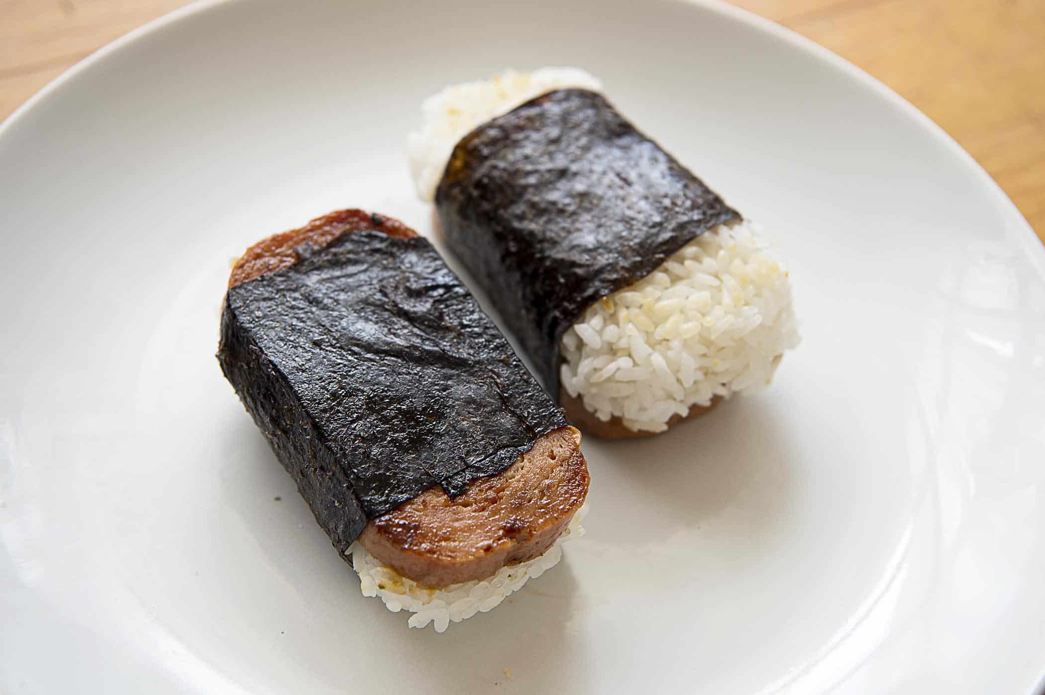 Two Spam musubis on a white plate