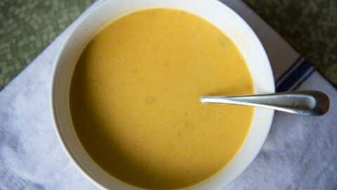 Savory butternut squash soup in a white bowl