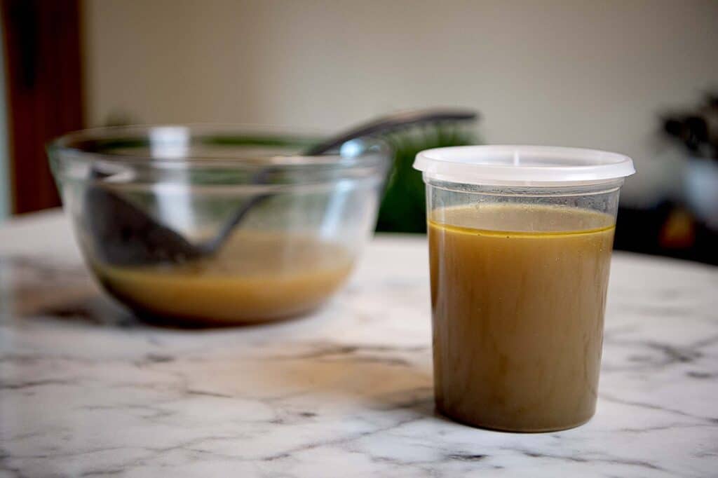 Chicken stock in a storage container