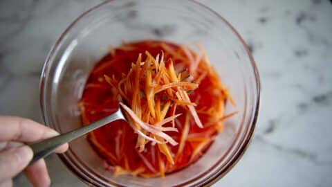 Pickled carrots in a clear bowl