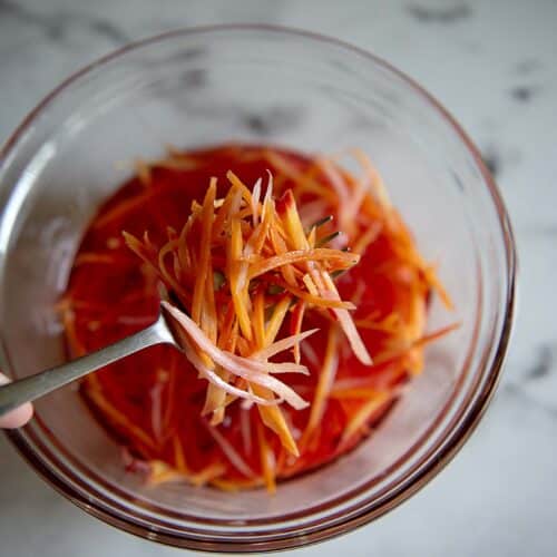 Pickled carrots in a clear bowl