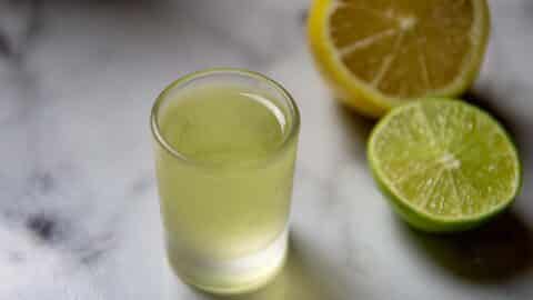 White Tea Shot Sitting on a Marble Table