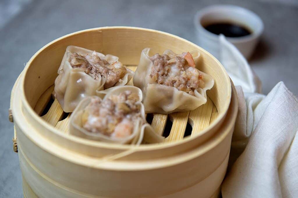 Shrimp shumai in a bamboo steamer