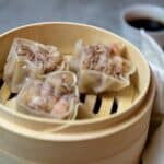 Shrimp shumai in a bamboo steamer