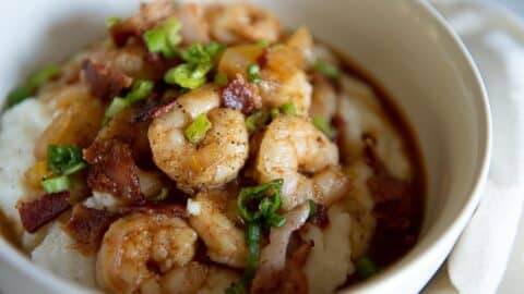 Shrimp and grits in a white bowl