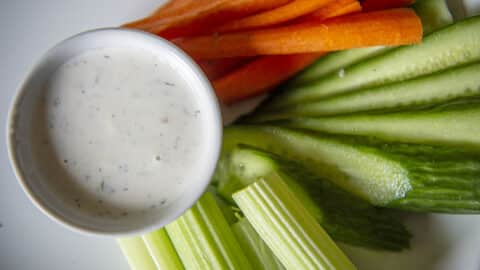restaurant ranch recipe in a ramekin with vegetables