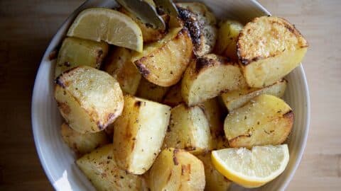 potatoes with lemon in a white bowl