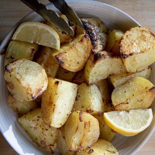 potatoes with lemon in a white bowl