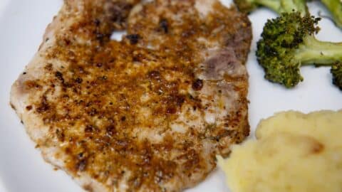 lemon pepper pork chops with mashed potatoes and broccoli