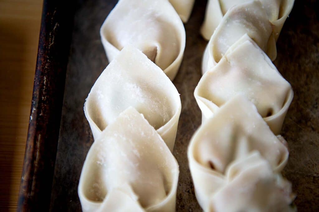 a row of homemade wontons