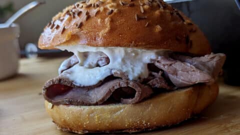 A beef on weck from the side, so you can see the entire sandwich.