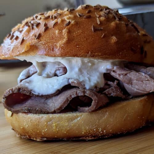 A beef on weck from the side, so you can see the entire sandwich.