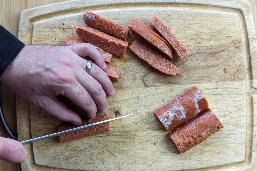 cutting pepperoni