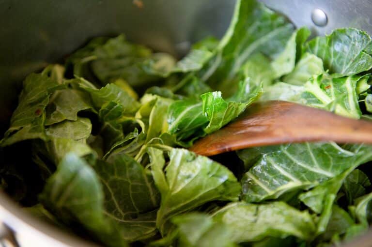 A close up of collard greens in a pot.