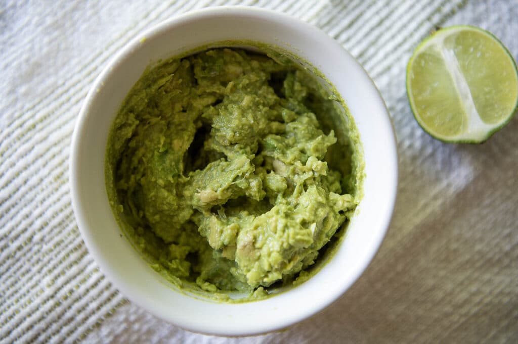 A top down shot of a 4 ingredient guacamole.