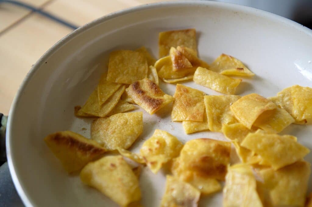 Corn tortillas being fried for Migas.