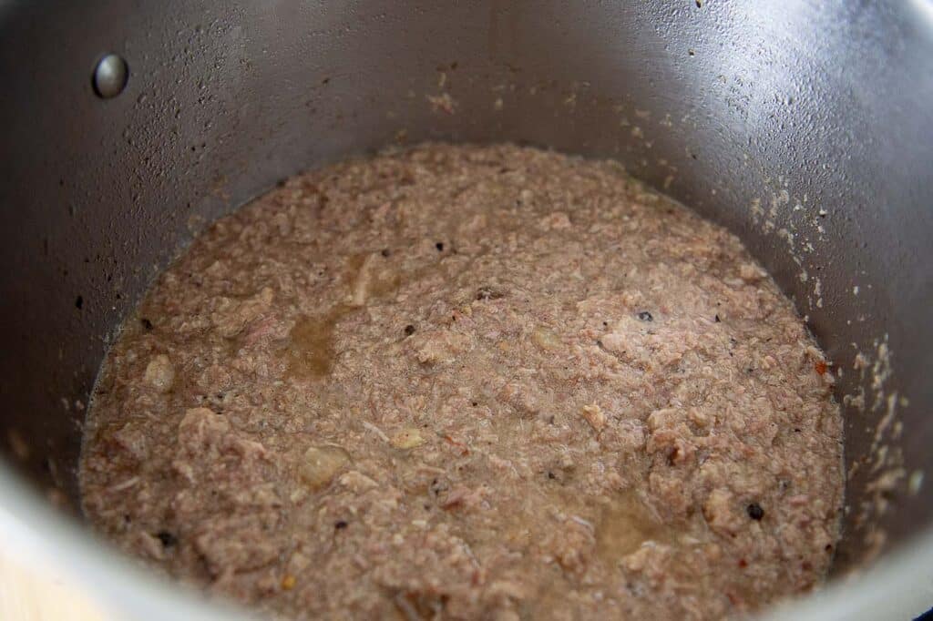 Hash cooking in a large pot.